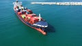 Spectacular aerial view of the bow of a container ship maneuvering upon arrival in port.