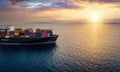 The bow of a container ship on open sea sailing into a sunset Royalty Free Stock Photo