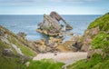 Bow Fiddle Rock, natural sea arch near Portknockie on the north-eastern coast of Scotland. Royalty Free Stock Photo