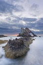 Bow-fidle Rock sunrise landscape on the coast of Scotland on cloudy morning Royalty Free Stock Photo