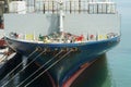 Bow and forward mooring station of the blue fully loaded vessel with reefer containers,