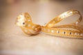 Bow. Golden satin gift bow. Ribbon. Christmas Royalty Free Stock Photo