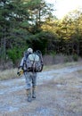 Bow hunter entering woods