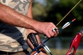 Bow hunter hands holding compound bow Royalty Free Stock Photo