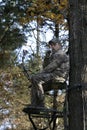 Bow Hunter Waiting in Tree Stand 2 Royalty Free Stock Photo
