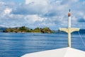 The bow of a liveaboard as it approaches a tropical island in Flores, Indonesia