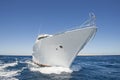 Bow of luxury private motor yacht under way sailing at sea Royalty Free Stock Photo