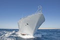 Bow of luxury private motor yacht under way sailing at sea Royalty Free Stock Photo