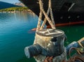 Bow and mooring lines of cruise ship tied to dock bollard,, Alaska. Royalty Free Stock Photo