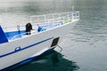 Bow of a pleasure yacht anchored. Empty tourist boat. Royalty Free Stock Photo