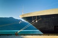 Bow, rat guards and mooring lines of berthed cruise ship,, Alaska, USA. Royalty Free Stock Photo