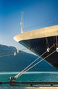 Bow, rat guards and mooring lines of berthed cruise ship,, Alaska, USA. Royalty Free Stock Photo