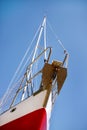 Bow of red and white sailboat, low angle Royalty Free Stock Photo