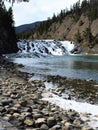 Riverstones and Waterfall, Bow River, Banff National Park Royalty Free Stock Photo