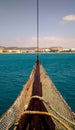 Bow sailboat near the shore