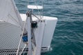 Bow of a Sailing Charter Catamaran Moving Through Blue Water