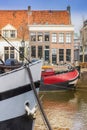 Bow of a ship in front of a typical dutch house in Zwolle