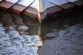 Bow of a ship of wood reflected in the water surface, abstract b Royalty Free Stock Photo