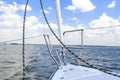 Bow of the Small Yacht Under Sailing On Open Waters. Royalty Free Stock Photo