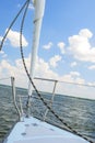 Bow of the Small Yacht Under Sailing On Open Waters Royalty Free Stock Photo