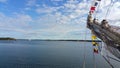 The bow of tall ship on the background of the sky with clouds. Tall Ship Races. Royalty Free Stock Photo