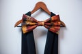 bow tie hanging on a suit hanger