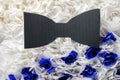 Bow tie light blue color on a background of gray marble.