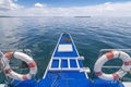 The bow of a tourist boat or locally known as a bangka. Cruising through glassy calm water off Bohol, Philippines