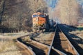 BNSF freight train stopped in siding during winter with leading line tracks Royalty Free Stock Photo