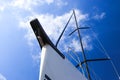 Bow of a white sailing yacht against the blue sky, generous copy space, selected focus. Royalty Free Stock Photo