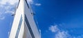 Bow of a white sailing yacht against the blue sky, generous copy space, selected focus. Royalty Free Stock Photo
