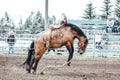 Bowden, Alberta, Canada, 26 July 2019 / Moments from the Bowden Daze, the town`s rodeo. Bronco riding, wild horse bucking and Royalty Free Stock Photo