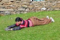 Bowed praying tibetan girl Royalty Free Stock Photo