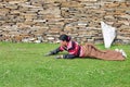 Bowed praying tibetan girl Royalty Free Stock Photo