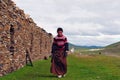 Bowed praying tibetan girl