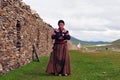 Bowed praying tibetan girl