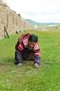Bowed praying tibetan girl Royalty Free Stock Photo