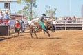 A cowboy riding a bucking bull Royalty Free Stock Photo