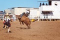 A cowboy riding a bucking bull Royalty Free Stock Photo