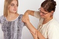 Bowen therapy of a young woman. The therapist giving bowen treat Royalty Free Stock Photo