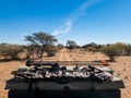 Bowhunting equipment on top of a truck traveling down a dirt road in Africa Royalty Free Stock Photo