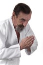 Bowing senior karate practicing man Royalty Free Stock Photo