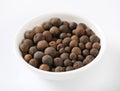 Bowl of allspice berries Royalty Free Stock Photo