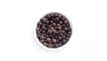 Bowl of allspice isolated on white background top view Royalty Free Stock Photo