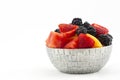 Bowl of antioxidant fruits piled with berries and melons Royalty Free Stock Photo