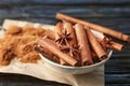 Bowl with aromatic cinnamon sticks and powder Royalty Free Stock Photo