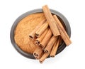 Bowl with aromatic cinnamon sticks and powder Royalty Free Stock Photo