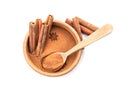 Bowl with aromatic cinnamon sticks and powder Royalty Free Stock Photo