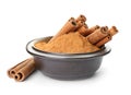 Bowl with aromatic cinnamon sticks and powder Royalty Free Stock Photo