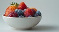 A bowl of assorted berries in a white ceramic dish, AI Royalty Free Stock Photo